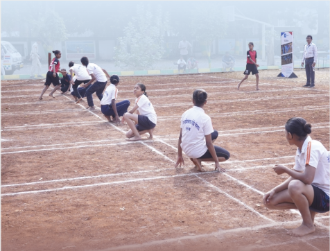 Students participating in a field sport activity supported by Bajaj Finserv