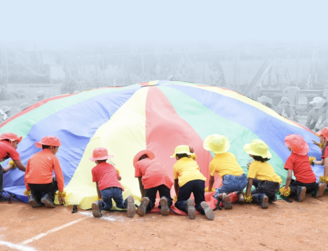Children participating in a school sports activity supported by KPMG